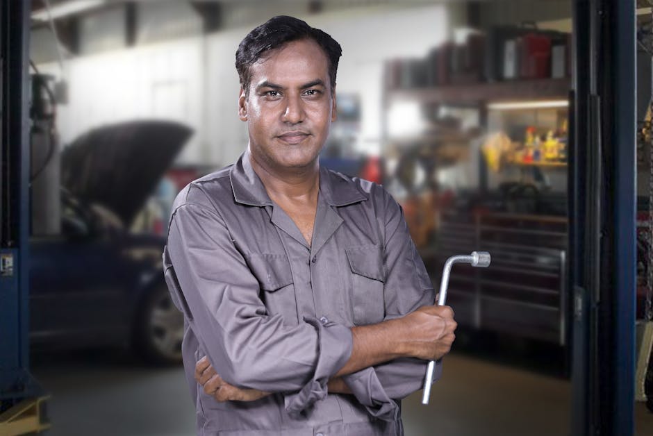 Friendly auto mechanic ready for windshield replacement